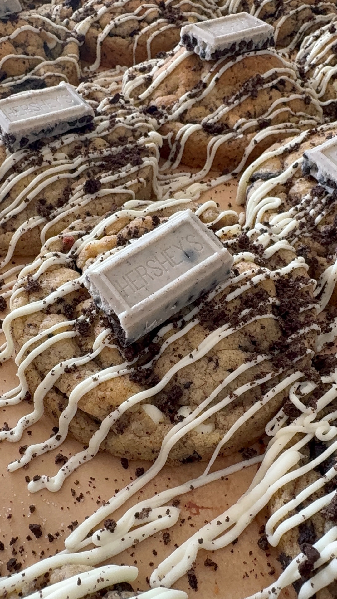 Cookies and cream cookies with white chocolate drizzle and Hershey's bars